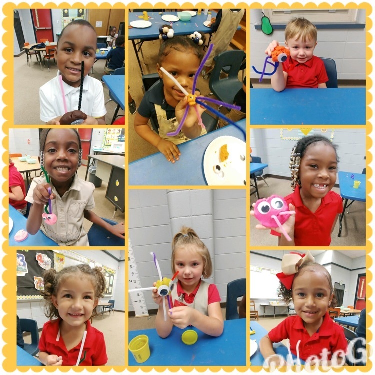 A few of Mrs. Emily and Mrs. Ena's friends in Health making germs with playdoh, googly eyes, and pipe cleaners.